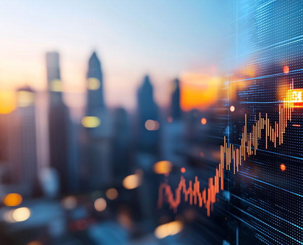 A modern city scape in the background at dusk with an overlay of a data graph showing economic data.